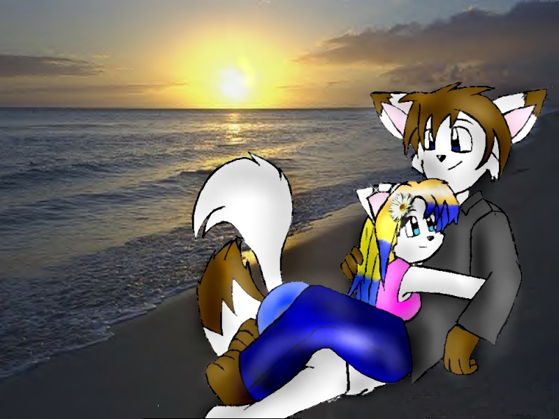 Missy and Aezon holding each other on the beach